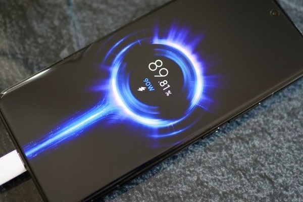 A cell phone with a blue circle and a blue light

Description automatically generated